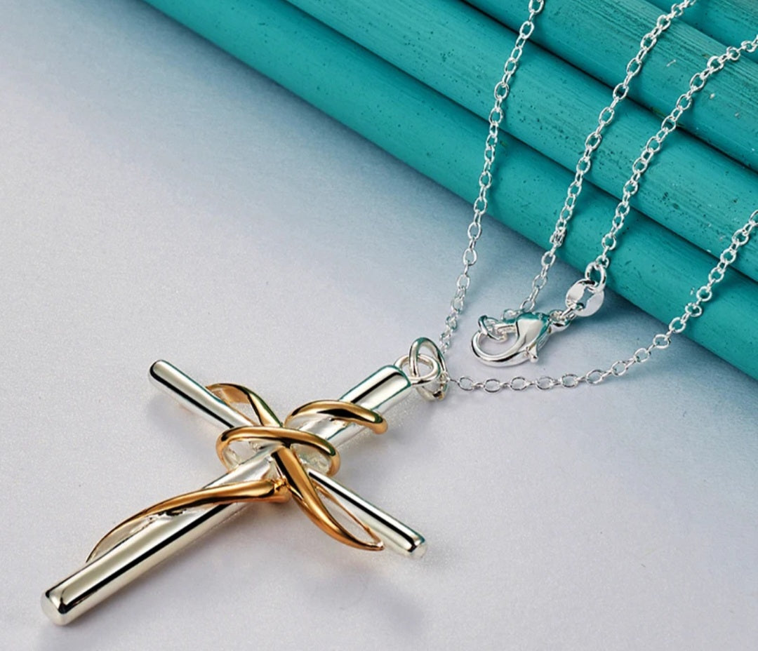 Silver cross with gold wrap